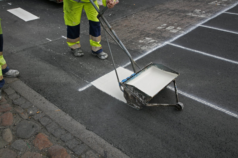 worker painting the road